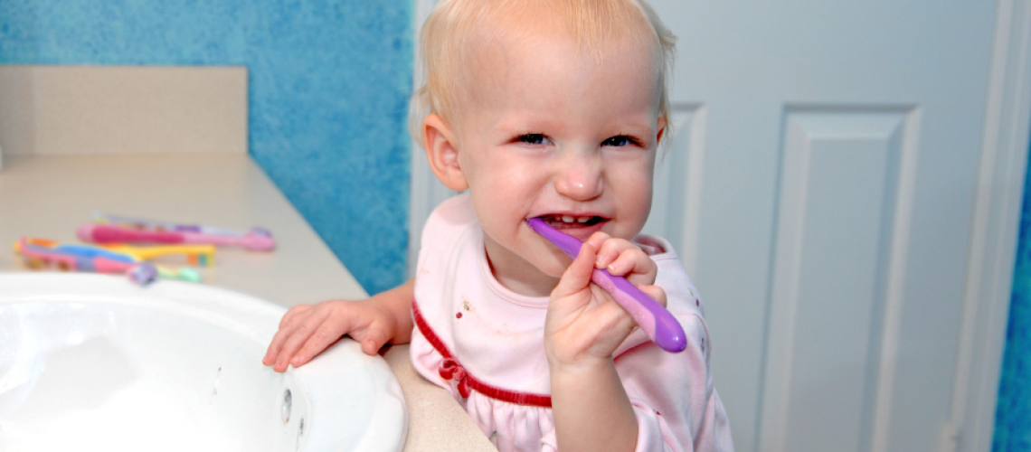 when to start brushing baby teeth
